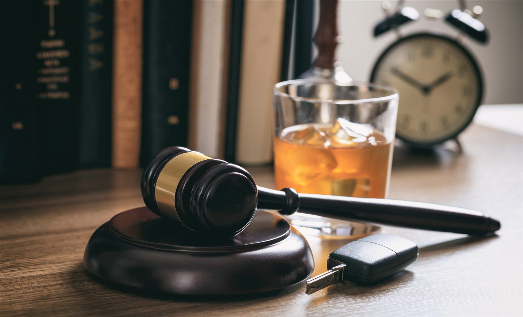 Gavel, clock, alcohol glass, and car key for retrograde BAC review